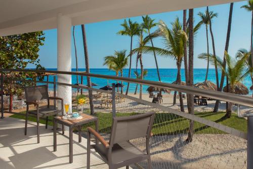 a view of the beach from the balcony of a resort at Dreams Flora Resort & Spa - All Inclusive in Punta Cana