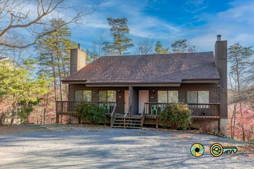 a house with a porch and a driveway at Senedo Springs Duplex #90B in Basye