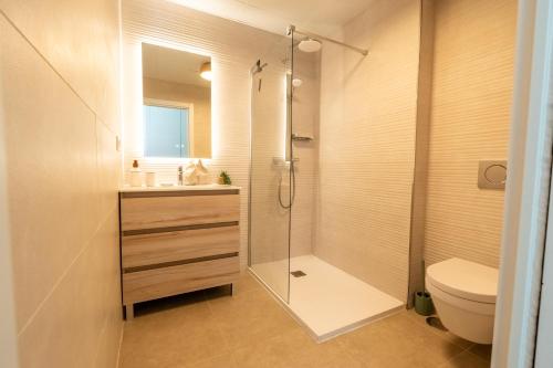 a bathroom with a shower and a toilet and a sink at Bayview Hills Apartamento Andaluz in Torrox