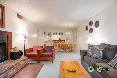 a living room with a couch and a fireplace at Senedo Springs Condo #2-202 in Basye