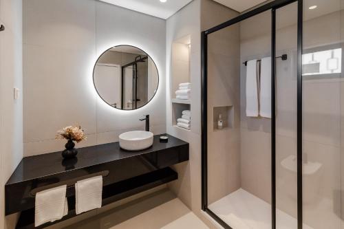 a bathroom with a sink and a mirror at Parque Monte Verde in Albufeira