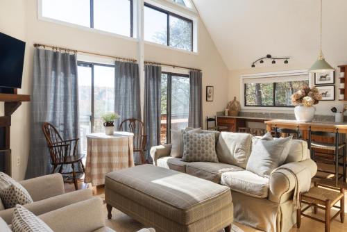 a living room with a couch and a table at 210 Nelson Way: Par Pine Lodge in Basye