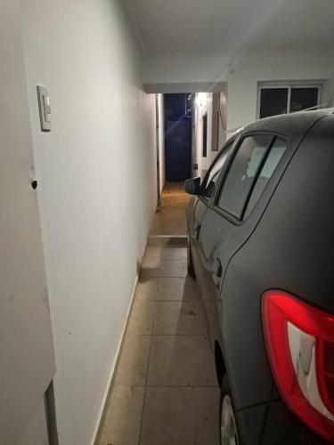 a car parked in a room with a hallway at Departamento Abu Dolly in La Plata