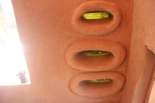 a close up of four donuts with a green topping at Amor pisciano 1 in Salinas