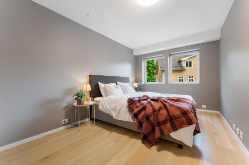 a bedroom with a bed and a window at Stryn Apartments - City Center - Modern Suites in Stryn