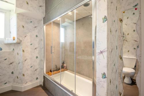 a bathroom with a shower and a toilet at 2 Bed in Eyemouth oc-77427 in Ayton