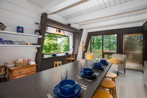 a kitchen with a table with blue dishes on it at 1186 Fairway Drive: Country Squire in Basye