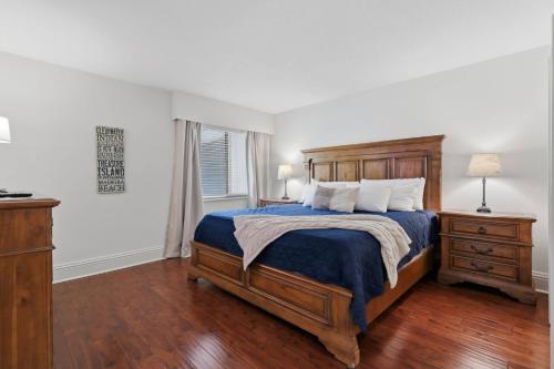 a bedroom with a bed and a dresser and a window at 14th Hole Golf Course Views! in Wesley Chapel