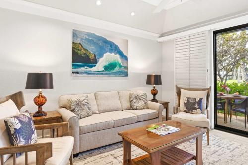 a living room with a couch and a table at Kiahuna 183 Ground Floor Ocean View PBAC in Koloa