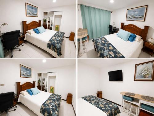 a hotel room with two beds and a desk at Alojamiento Cereza 2 in Alajuela