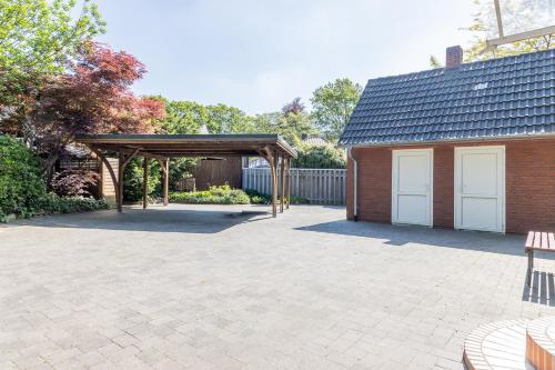a patio with a pavilion next to a building at Lieblingsplatz in Lathen