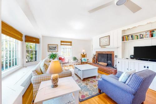 a living room with a couch and a fireplace at Edgartown Cozy Corner in Edgartown