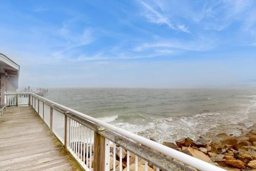 a view of the ocean from a pier at Seabreeze Retreat in Oak Bluffs