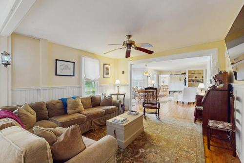 a living room with a couch and a table at Beach House in Oak Bluffs