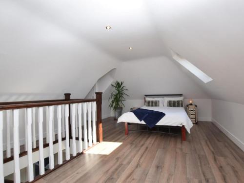 a bedroom with a bed and a staircase at 2 Bed in Lamesley oc-cn107 in Lamesley