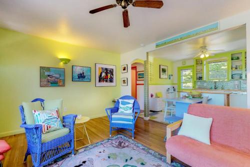 a living room with a couch and chairs and a kitchen at Sunset Meadows in Oak Bluffs