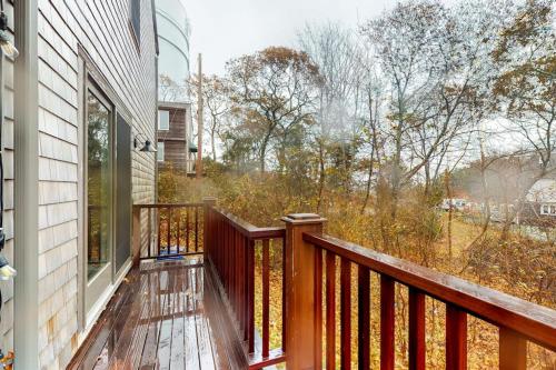 a balcony with a view of a yard at Summer Sun in Provincetown
