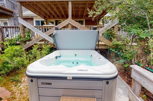 a hot tub in the backyard of a house at Bayview in Truro