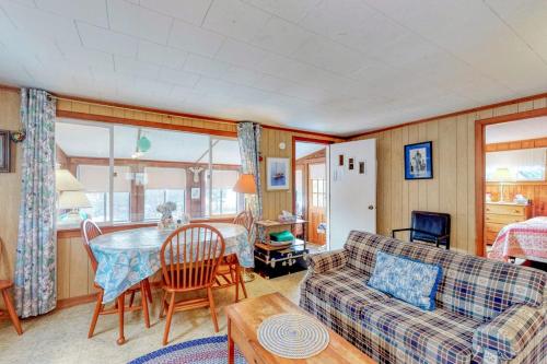 a living room with a couch and a table at Villa Fairview in South Dennis