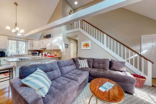 a living room with a couch and a table at Sit Back & Relax in Eastham