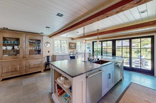 a large kitchen with a sink and a counter at The Long Fox in Provincetown