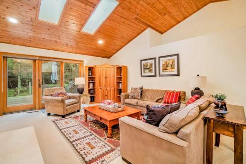 a living room with a couch and a table at Between the Lakes in Glen Arbor