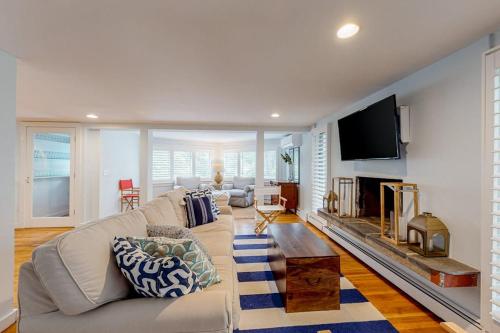 a living room with a couch and a tv at Lake Elizabeth Terrace in Centerville