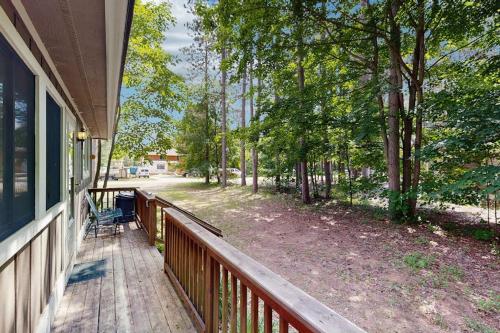 a porch of a house with a chair on it at The Treehouse in Thompsonville