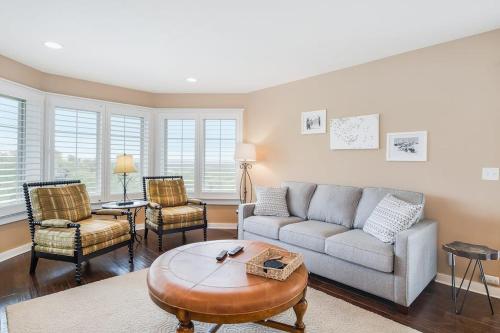 a living room with a couch and a table and chairs at Mountain Top 713 in Thompsonville