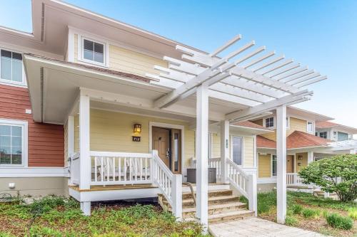 a white pergola on the front of a house at Mountain Top 713 in Thompsonville
