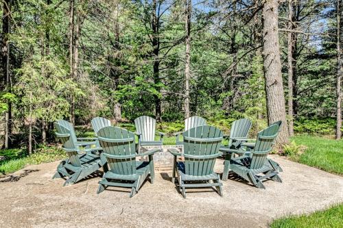 a group of green chairs and a table and chairs at The Raccoon in Conover