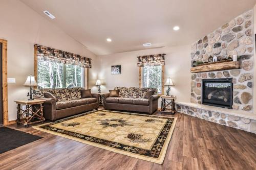 a living room with two couches and a fireplace at The Wildwood in Conover