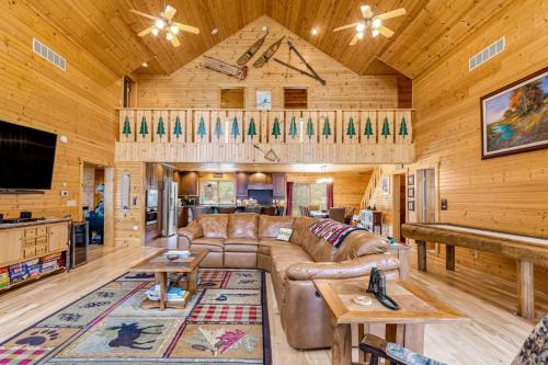 a living room with a couch and a table at Serenity at Stormy Lake in Conover