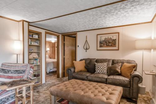 a living room with a couch and a table at The Trail Hub in Mercer