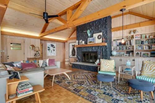 a living room with a couch and a fireplace at Northwoods Oasis in Land O' Lakes