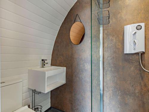 a bathroom with a sink and a basketball on the wall at 1 Bed in South Brent oc-86947 in South Brent
