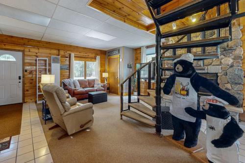 a room with a lobby with a bear statue in it at Roaming Deer Cottage in Saint Germain