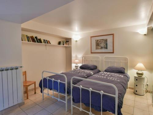 a bedroom with two beds in a room at Paulette in Éze