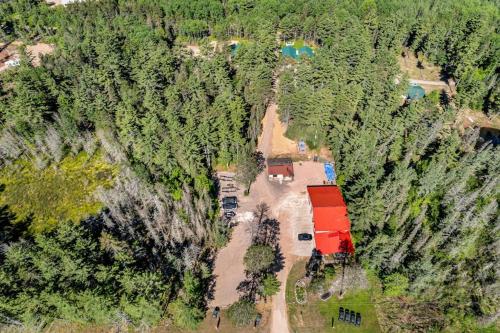 an aerial view of a house in the middle of a forest at The Beaver in Conover