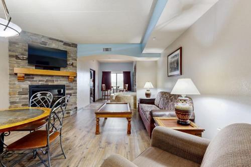 a living room with a couch and a fireplace at Chula Vista Condo, Unit 2344 in Wisconsin Dells