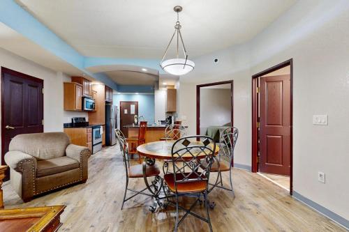 a kitchen and living room with a table and chairs at Chula Vista Condo, Unit 2344 in Wisconsin Dells
