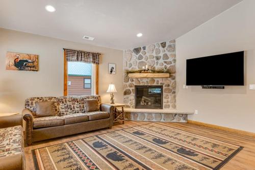 a living room with a couch and a fireplace at The Wilderness in Conover