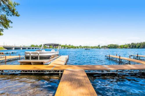 a boat is docked at a dock on a lake at Lake Minocqua Lakeview in Minocqua