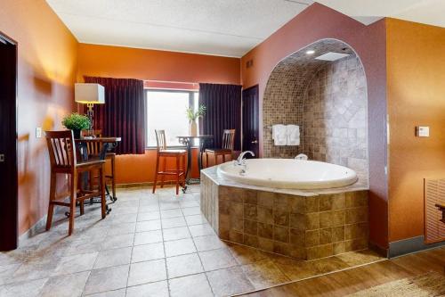 a large bathroom with a tub and a dining room at Chula Vista Condo 2632/2634 in Wisconsin Dells