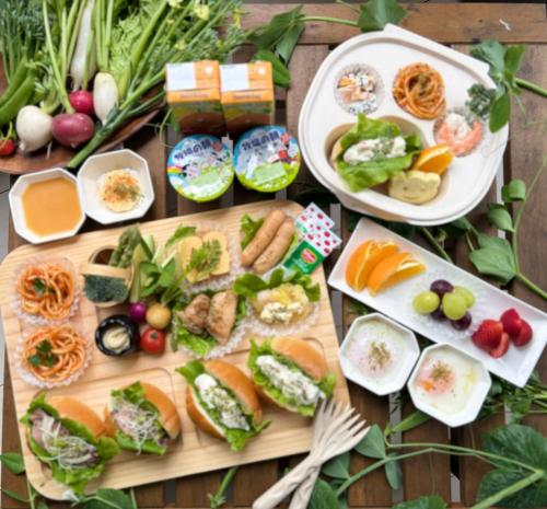 a table with a variety of food on it at グランコテージベンガルの森 in Nasu