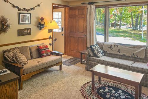 a living room with a couch and a table at Cleerwood Village #261 in Eagle River
