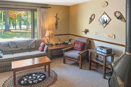 a living room with a couch and a table at Cleerwood Village #261 in Eagle River