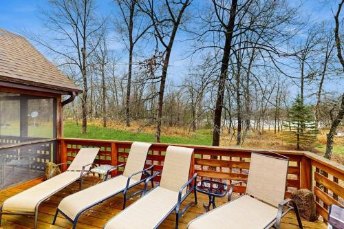 a group of chairs sitting on a deck at Nekoosa Holiday in New Rome