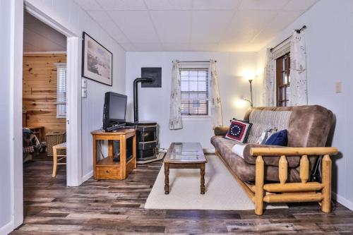 a living room with a couch and a coffee table at West Bay Pines in Saint Germain