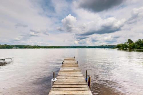 a wooden dock in the middle of a lake at Catfish Cottage B in Eagle River